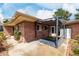 An inviting brick house with a covered patio area and outdoor storage at 6005 W 39Th Ave # 6005, Wheat Ridge, CO 80033