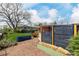 A well-maintained backyard with a privacy fence and raised garden beds at 6005 W 39Th Ave # 6005, Wheat Ridge, CO 80033