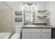 Bathroom featuring a vanity with integrated sink, a shower/tub, and modern fixtures at 6005 W 39Th Ave # 6005, Wheat Ridge, CO 80033