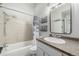 Well lit bathroom featuring a vanity with integrated sink, a shower/tub, and modern fixtures at 6005 W 39Th Ave # 6005, Wheat Ridge, CO 80033