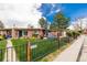 Attractive home featuring a well-maintained lawn, wrought iron fence, and clear street number at 6005 W 39Th Ave # 6005, Wheat Ridge, CO 80033