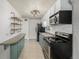 Compact kitchen featuring essential appliances, clever storage solutions, and functional design at 6005 W 39Th Ave # 6005, Wheat Ridge, CO 80033