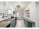 Efficient kitchen design featuring modern appliances, smart shelving, and a clean aesthetic at 6005 W 39Th Ave # 6005, Wheat Ridge, CO 80033