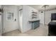 The kitchen area features neutral tile flooring, sleek cabinetry, and modern lighting at 6005 W 39Th Ave # 6005, Wheat Ridge, CO 80033