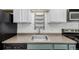 Cozy kitchen features ample countertop space, cabinet storage, and essential appliances at 6005 W 39Th Ave # 6005, Wheat Ridge, CO 80033