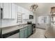 Functional kitchen with updated appliances, bright cabinets, and space-saving shelving at 6005 W 39Th Ave # 6005, Wheat Ridge, CO 80033