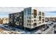 Modern building with a mix of dark brick and grey panels and balconies at 1898 S Bannock St # 505, Denver, CO 80223