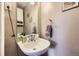Compact bathroom features a pedestal sink and stylish accents at 8051 Wolff St # I, Westminster, CO 80031