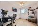 Bedroom features a ceiling fan, window, and space for a work-station and a cat tree at 8051 Wolff St # I, Westminster, CO 80031