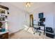 Bedroom featuring a ceiling fan, large closet, and desk area at 8051 Wolff St # I, Westminster, CO 80031