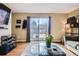 Cozy living room with a glass coffee table and a sliding glass door to the outdoor area at 8051 Wolff St # I, Westminster, CO 80031