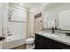 Full bathroom featuring a shower and tub combination, granite counters, and bronze hardware at 8852 Ventura St, Commerce City, CO 80022