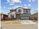 Charming two-story home with neutral paint, stone accents, and a spacious two-car garage at 8852 Ventura St, Commerce City, CO 80022
