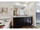 Spacious bathroom with a double sink vanity, granite counters, and tiled flooring at 8852 Ventura St, Commerce City, CO 80022
