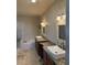 Spacious bathroom with dual vanities, granite countertops, vessel sinks, a soaking tub, and a glass-enclosed shower at 20678 E Lake Cir, Centennial, CO 80016