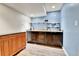 Bar area with cabinets, countertops, and a small shelf at 562 Gallo St, Brighton, CO 80603