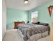 Bedroom with a large bed, dresser, and a window for natural light at 562 Gallo St, Brighton, CO 80603