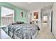 Bedroom featuring a large bed with shelves, desk and doorway to the living room at 562 Gallo St, Brighton, CO 80603