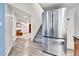 Modern stainless steel refrigerator in the kitchen with access to the open living area at 562 Gallo St, Brighton, CO 80603