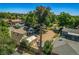 Aerial view of a property with large yard, gravel parking, and neighboring homes at 449 Lowell Blvd, Denver, CO 80204