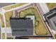 Aerial view of a home with solar panels, a concrete patio, a well-maintained lawn, and a fenced backyard at 17960 Weymouth Ave, Parker, CO 80134
