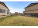 Spacious backyard featuring a lush lawn and a wood fence, perfect for outdoor activities at 17960 Weymouth Ave, Parker, CO 80134