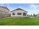 Expansive backyard featuring a well-kept lawn, patio and views of the surrounding area at 17960 Weymouth Ave, Parker, CO 80134