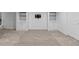 Spacious basement featuring neutral walls, carpeted floors, and built in cabinets at 17960 Weymouth Ave, Parker, CO 80134