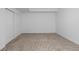 Spacious basement with neutral color walls, carpeted floors, and double door closet at 17960 Weymouth Ave, Parker, CO 80134