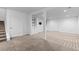 Spacious basement with new carpet, recessed lighting, and built-in shelves at 17960 Weymouth Ave, Parker, CO 80134