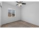 Bright bedroom with a large window and neutral carpeting at 17960 Weymouth Ave, Parker, CO 80134