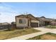 Well-maintained home showcasing a green lawn, complemented by a two-car garage, and inviting curb appeal at 17960 Weymouth Ave, Parker, CO 80134