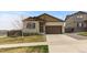 Charming single-Gathering home with a well-maintained lawn, complemented by a two-car garage at 17960 Weymouth Ave, Parker, CO 80134