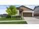 Charming home with a well-maintained lawn, lush landscaping, and a two-car garage at 17960 Weymouth Ave, Parker, CO 80134