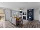 Cozy living room with fireplace and an abundance of natural light creates a warm and inviting atmosphere at 17960 Weymouth Ave, Parker, CO 80134