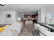 Open living space with seamless flow to kitchen and dining areas, perfect for modern living and entertaining at 17960 Weymouth Ave, Parker, CO 80134