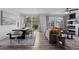 Bright living space with large windows, dining area, and comfortable seating for relaxation and entertainment at 17960 Weymouth Ave, Parker, CO 80134