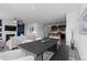 Spacious open-concept living room and kitchen area ideal for modern living and entertaining guests at 17960 Weymouth Ave, Parker, CO 80134