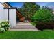 Expansive backyard with a covered patio, lush greenery, and a serene atmosphere for outdoor enjoyment at 346 Elm St, Denver, CO 80220