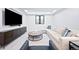 Spacious basement living area featuring contemporary furnishings and ample natural light at 346 Elm St, Denver, CO 80220