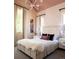 Charming bedroom featuring soft lighting, plush bedding, and decorative accents at 346 Elm St, Denver, CO 80220