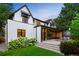 Stunning two-story home with manicured landscaping, a lush green lawn, and classic architectural details at 346 Elm St, Denver, CO 80220
