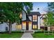 Charming home with a well-manicured lawn, beautiful landscaping, and a welcoming front entrance at 346 Elm St, Denver, CO 80220