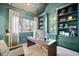 Modern office featuring stylish built-in shelves, a large window, and contemporary decor at 346 Elm St, Denver, CO 80220