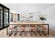 Bright open kitchen with a large center island and modern lighting fixtures, adjacent to a table at 346 Elm St, Denver, CO 80220