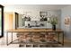 Bright open kitchen with a large center island and modern lighting fixtures, adjacent to a table at 346 Elm St, Denver, CO 80220
