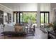 Open-concept living room with stylish furniture and a seamless transition to the outdoors at 346 Elm St, Denver, CO 80220