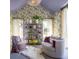 Bright sitting room with vaulted ceilings, decorative wallpaper, and comfortable seating at 346 Elm St, Denver, CO 80220