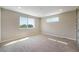 Bright bedroom with large windows offering outside views and neutral walls and carpet at 8500 W 62Nd Ave # D, Arvada, CO 80004