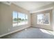 Bright bedroom with large windows and neutral carpet at 8500 W 62Nd Ave # D, Arvada, CO 80004